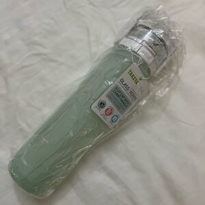 TAKEYA glass water bottle with green silicone sleeve